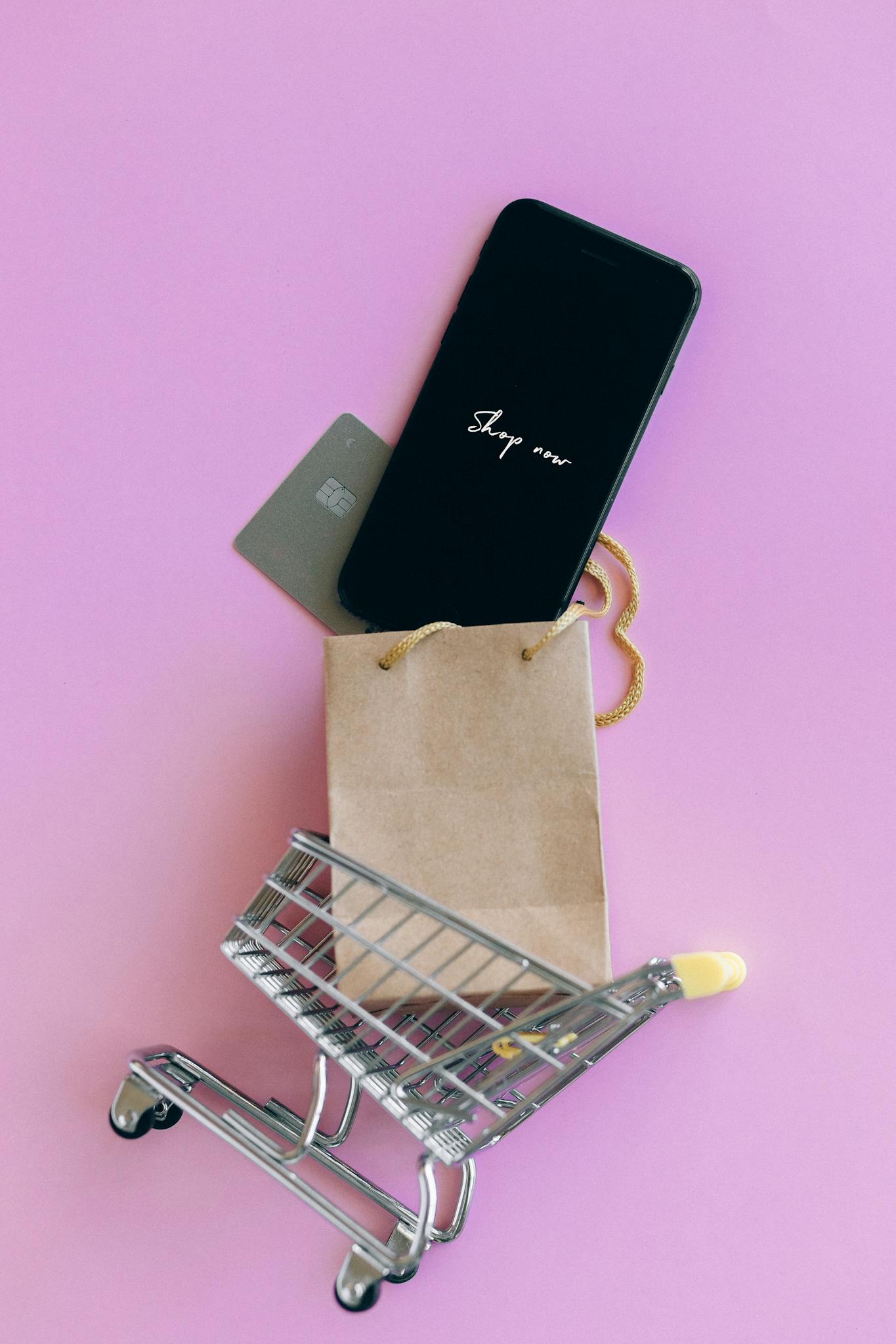a smartphone credit card and bag in