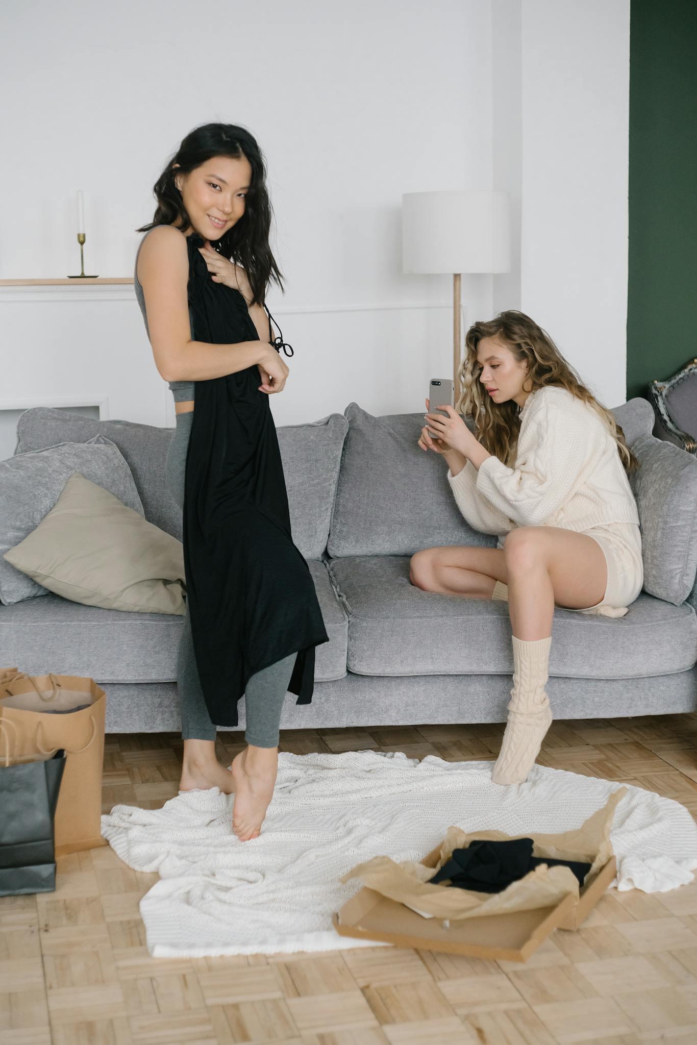 two women relaxing while trying on new